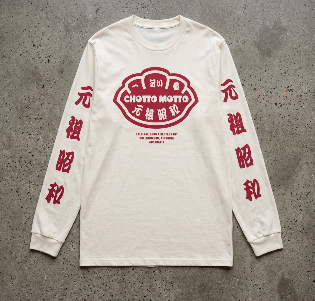 An off-white long-sleeve t-shirt with red graphic prints, laid flat on a gray concrete background. The center features a red 'CHOTTO MOTTO' logo with Japanese characters, and the sleeves have red vertical Japanese characters.